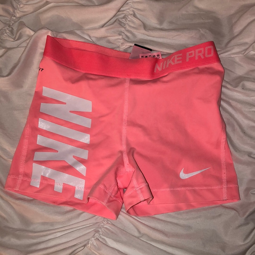 Bubble Gum Pink Nike Pros with “NIKE”
